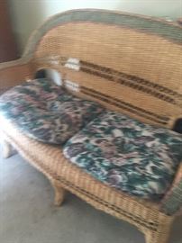 Wicker love seat with matching chair. 