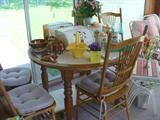Another good view of the dining set. Leaf is not shown. It sits against the side wall. No room to put it in the table. Nicely made quality set with gear cog table where the leaf inserts.