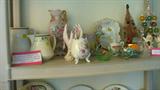 Syracuse China railroad pitcher, Limoges bowl, musical brush revolving Christmas tree and other misc glass pieces on this shelf