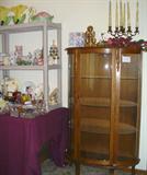 A lovely curio cabinet with rounded front and pictures of more of the glassware selection.