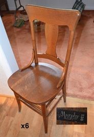 6 oak chairs marked Murphy Incorporated,Owensboro KY 136. To be sold with pub table.