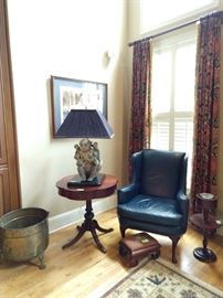 Before you ask, yes, all window treatments are for sale, none of the crappy light fixtures, but ALL window treatments. Nice blue leather wingback armchair, 1940's vintage scalloped drum table, antique needlepointed footstool, vintage mahogany smoking stand, big ol' brass planter with hairy paws and last, but certainly not least, the "Lady Madonna" porcelain monkey table lamp!