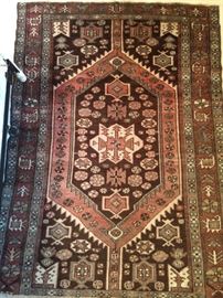 Vintage hand woven Persian Viss rug, 100% wool face, measures 4' 4" x 6'.