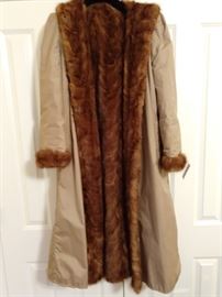 Here's something you won't see very often - a reversible, mink-lined raincoat - LOVE IT! It's also a size 8, so don't be late!
