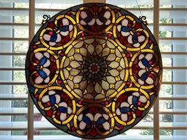 There's a pair of these stained glass windows in the breakfast room, for glorious mornings, enjoying a freshly prepared breakfast by your loving honey.