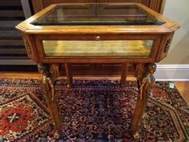 FULL STOP! You will not see one of these again in a loooong time! The entire vitrine is covered in tooled leather, beveled glass all around and the Egyptian revival gilt brass mounts are exquisite!