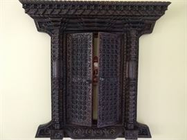 Hand carved wood, wall hung Balinese temple door.