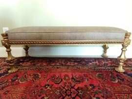 Handsome European gilt wood bench, with pleather upholstery.