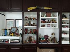 Hmm, you're retired, you still have a home office with a built-in storage unit - what to do? As you sit and stare at the void, think about filling it with treasures from your trips - yeah, that's it! SO, here we have a wall full o' goodies for your browsing (purchasing!) pleasure.