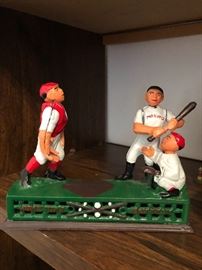 Casted iron bank with baseball motef