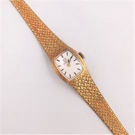 Omega 14K Gold watch and band.