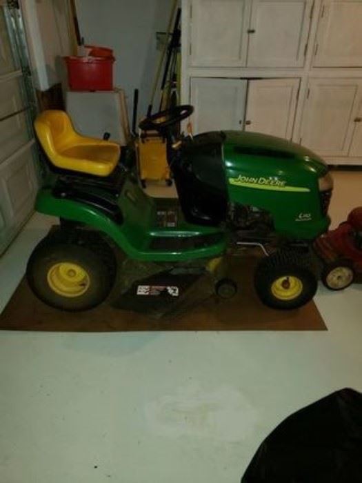 John Deere riding mower. Runs and works. Low hours.