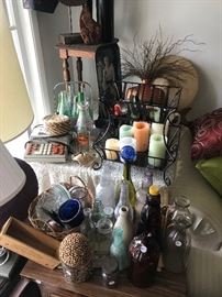 Candles, end table, glass bottles 