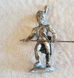 small antique metal soldier with French coin base
