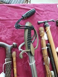 First from right: Flicker dagger cane - silver figural dog handle ( see close up of the dagger) Second from right: Silver mounted regimental cane. Third from right: WWI regimental trench art cane center:19th century French cavalry sword