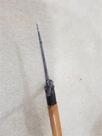 side view f dagger point on the top of the cane