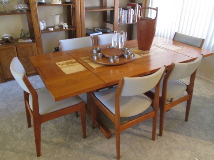 Danish Modern Teak Dining Room Table/6-Chairs with 2 Side Leaves.  Tile Insets down the center of the table.    Leaves drop down and pull out for function.