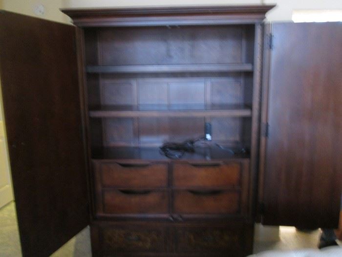 Interior view of the Armoire.  Shelves are adjustable and there's power cords for a TV