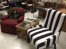 Black & white stripe contemporary chair; small red rocking chair and wicker/glass table that can be a side table or a coffee table.
