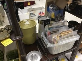 Vintage Tupperware canister set and box of cookbooks and phamphlets