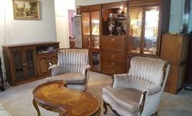 2 Tufted Bergere Chairs, carved with 'maidenhead' decorations. 3 Piece illuminated Curio with center desk and drawers. Smaller buffet/entertainment cabinet.