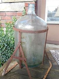 GREAT OLD BOTTLE IN METAL STAND 
