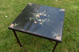 Vintage square folding card table with floral design.