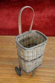 Vintage wicker rolling market basket.