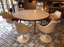 60” diameter Formica table and fiberglass tulip chairs!