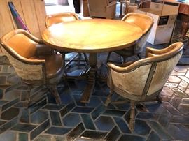 Round wood table and 9 (yes nine!) cow hide club chairs!