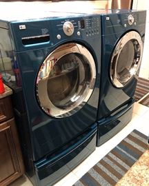 This LG Top Loader Washer & Dryer matching soft blue with lower storage draws is ideal for the Family, a large-capacity machine handles bulkier items, like bedding and has options for frequent, large loads of clothing and towels.