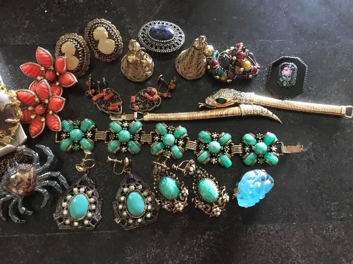 Over 100 piece collection of vintage & signed costume jewelry..including matched pairs of earrings, necklaces ,broaches and bracelets.......All very clean.....