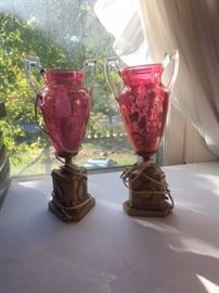 A pair of cranberrry glass lamps, in the pink bedroom on the second floor. 