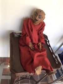 A vintage puppet from Burma, with articulated hands. Ready to sit in a chair or hang on a wall. In the pink bedroom on the second floor.