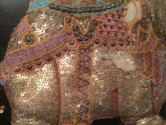 Detail of sequin work & embroidery on monumental framed Burmese kalaga - on the fireplace mantle in the dining room. 