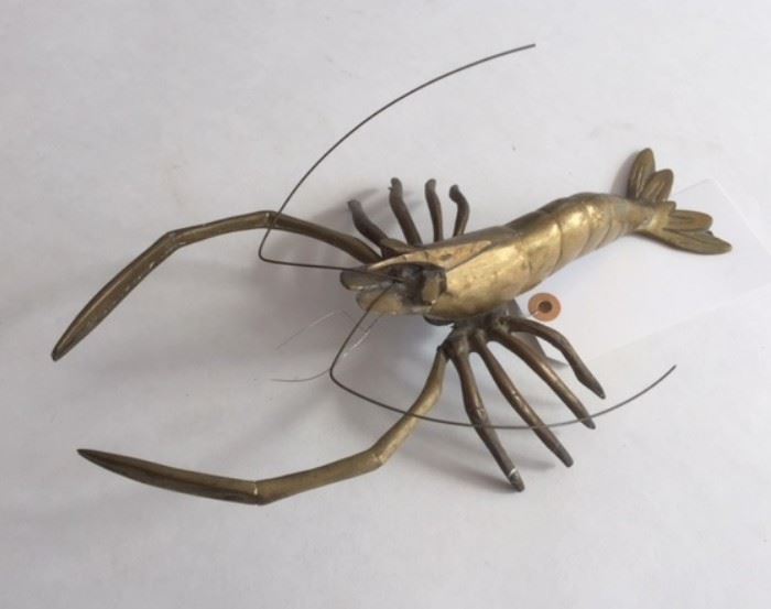 Antique Chinese brass lobster with moveable limbs. In the dining room. 