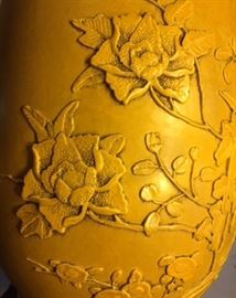 Detail #1 of the antique Chinese carved yellow porcelain vases in the dining room. 