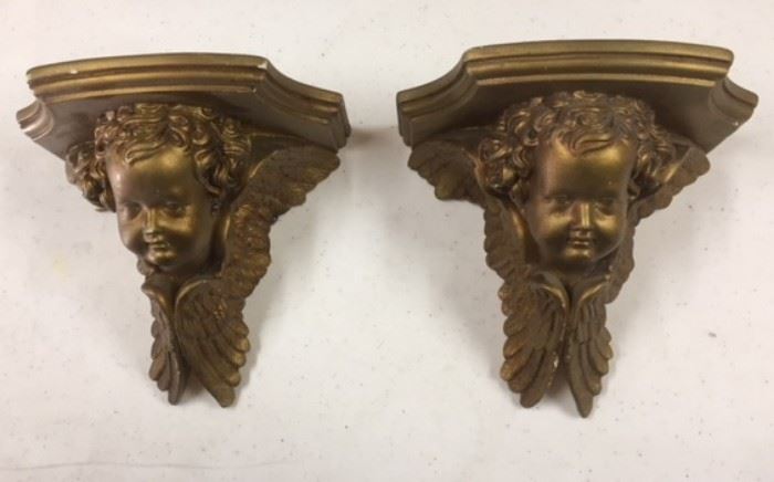 Two gilt wood wall shelves featuring winged cherubs.  In a room off of the ballroom. Some condition issues but still very charming. 