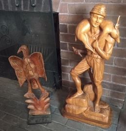 Two wooden sculptures. Near the fireplace in the third floor ballroom. 
