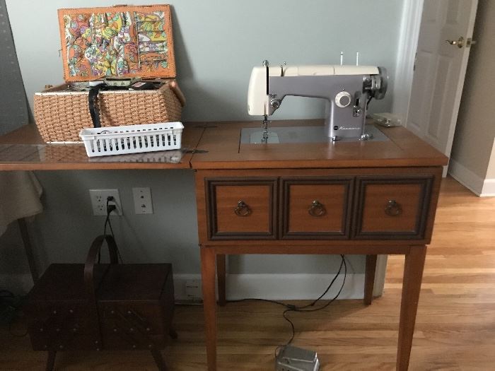 A Sears Brand Electric Sewing Machine in nice Mid-Century cabinet would be a great start for the accomplished seamstress or seamstress wanna-be!  Lots of cool sewing notions also fill this corner of the room.  