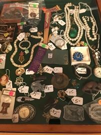 Classy costume jewelry, nice belt buckles, pocket watch w/a sweet fob on it, and much more awaits you.  