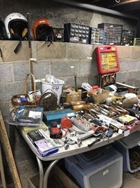 A man has to have a place to shop too, you know, and we've got just the spot fellows!  Lots of nuts, bolts, screws, tools, etc. wait in the basement.  Plus a couple of nice riding helmets 