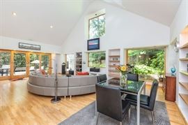 Oval leather sectional and black top glass table that extends