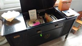 Old. Radio still plays extremely well, turntable turns on, but will not rotate. The cabinet itself is unusual-asian motif. Just a good, old piece waiting for a new home.