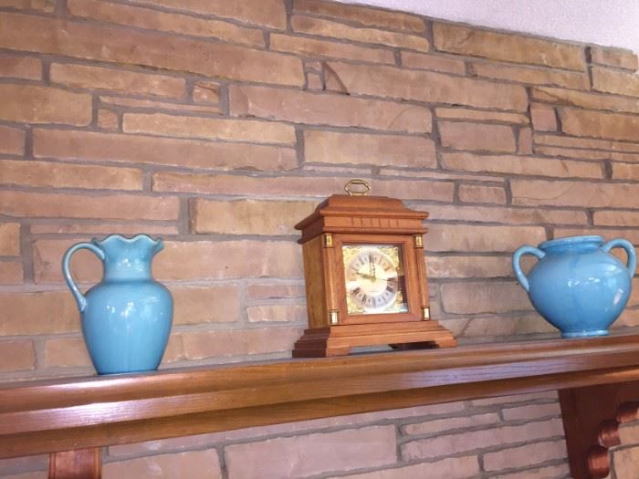 mantle clocks and lots of Turquoise pottery to match the perfect turquoise tiled kitchen