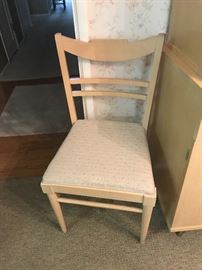 One of two retro chairs for table