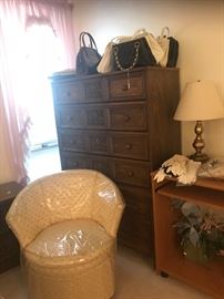 Ladies purses, retro chair with the plastic still intact and the large dresser part of the set.  Can be sold separate.