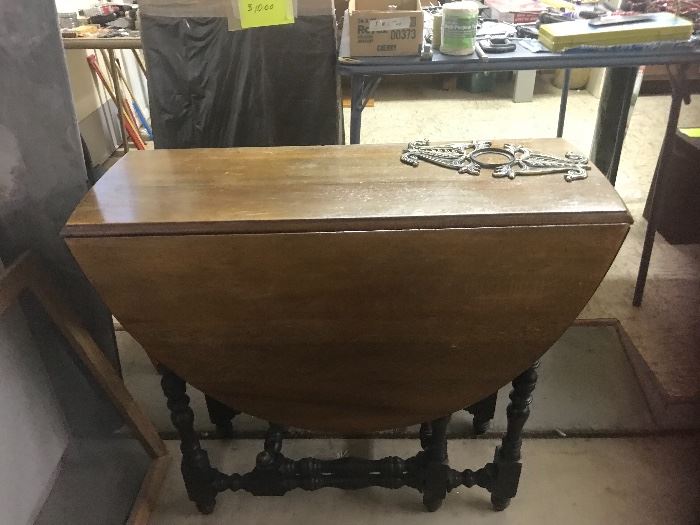 Drop leaf table, not in the greatest condition.  There is another one in the house hallway which is really nice.  This would be nice for a small apartment .  Some paint and it would look great.  No chairs.