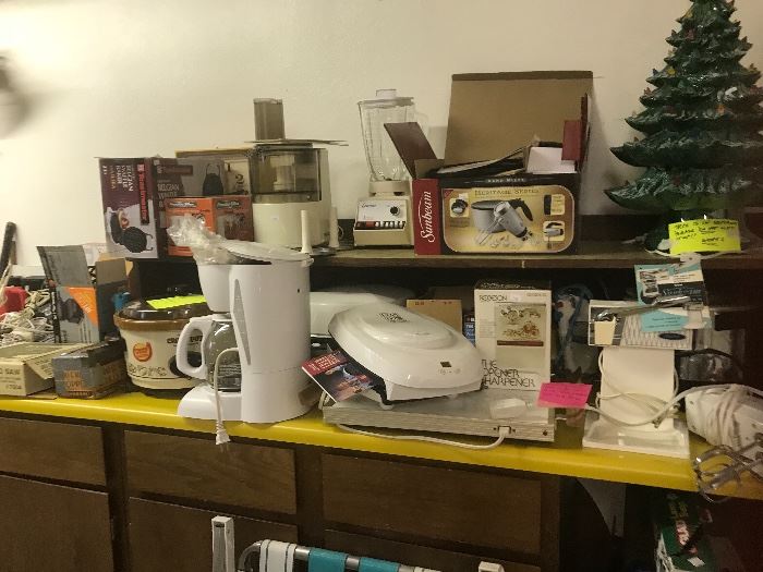 This shelf is filled with kitchen appliances all which have been tested and do work.  Also a large ceramic Christmas tree (note it is in 3 sections) so do not attempt to take it down yourself.