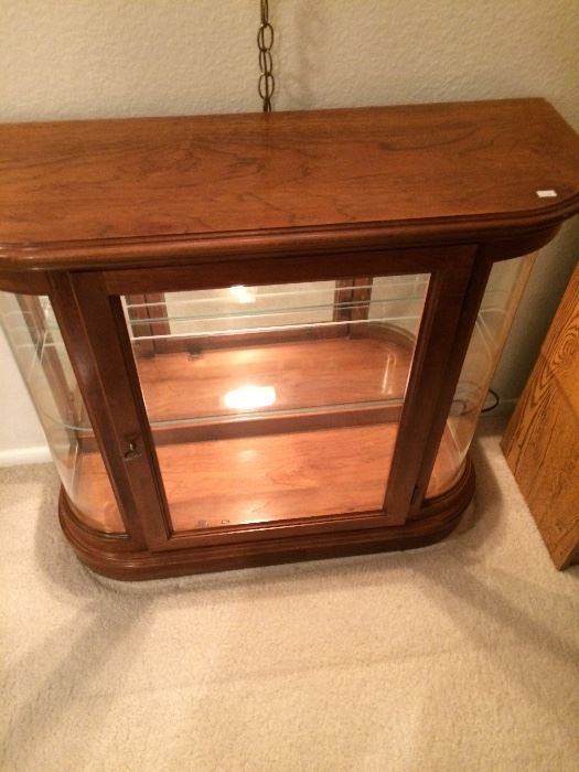 Neat retro curio cabinet located in living room entry